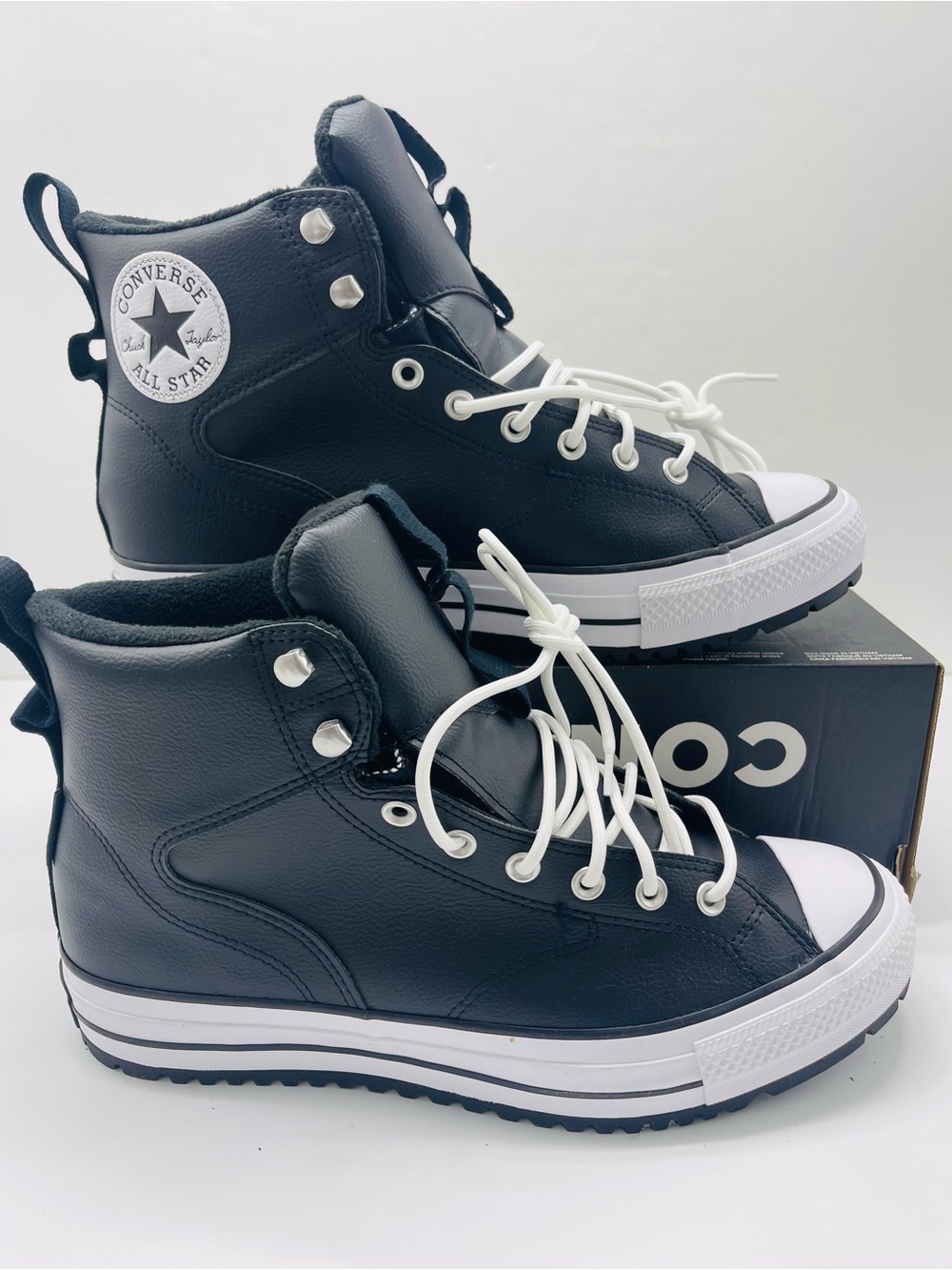 Converse A13233C CTAS HIKER BOOT HI
BLACK/BLACK/WHITE 
 Black Leather High-Top